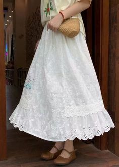 Classy White Embroideried Elastic Waist Cotton Skirt SummerFabric: Cotton BlendedSize & Fit: This garment fits true to size.Length: Size XL measures 30.42"from waist to hem.Waist:Fitted - elastic waist allows stretch Hip: Loosely Fitted. room for hips. Hand Wash Cold.