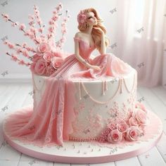 a cake decorated with pink flowers and a woman in a dress sitting on top of it