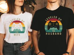 "Leveled Up To Husband & Wife Shirt, Couples Gamer Shirt,Fiancee Shirt, Gift For Husband, Gift For Wife, Just Married Shirts, Newlywed Shirts 📢Please Check All Photos For Details.   📢Choose Your T-Shirt Size From The Drop-Down Lists Next To The item Picture   📢Choose Of Your T-Shirt Color From The 2nd Picture   📢Use \"Add message to Seller\" link On The Checkout Page To Send me the Following important Details For Your Order's Customization.   📢Shipping Time Varies by location (we are located in Sugar Land, Texas) please consider that our turn around time is 1 to 3 business days.   📢 ⭐Which brand do you use for t-shirts? We use Softstyle Gildan, Bella Canvas Unisex, Comfort Color, Hanes, District, Outlash, Tees and Next Level when we have a shortage of stocks for certain colors and si Newlywed Shirts, Fiancee Shirt, Just Married Shirts, Dino Shirt, Married Shirt, Gamer Shirt, Tea Shirt, Sugar Land, Gift For Husband