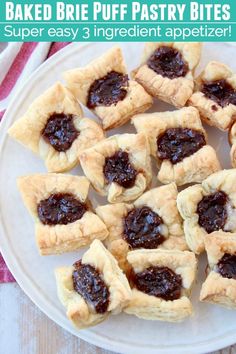 baked brie puff pastry bites on a plate with the words, baked brie puff pastry bites super easy 3 ingredient appetizer