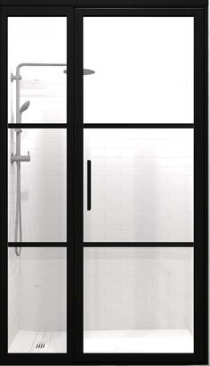 an open shower door in a white tiled bathroom with black trim and clear glass doors