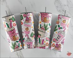 four decorated paper umbrellas sitting on top of a marble counter