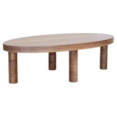 an oval wooden table with three legs and a circular top, on a white background