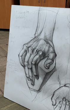 a drawing of two hands holding each other's hand on a piece of paper