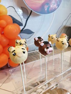 there are some cake pops with animals on them