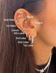 a woman wearing three different ear piercings with the measurements for each piece in her ear