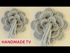 there are two crocheted flowers on the wall and one is made out of yarn