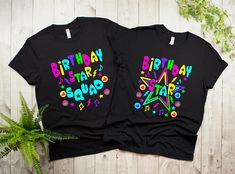 two black birthday t - shirts with stars and confetti on the front, one in bright colors