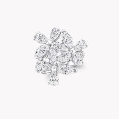 a white gold and diamond brooch, by van cleef in the shape of a snowflake