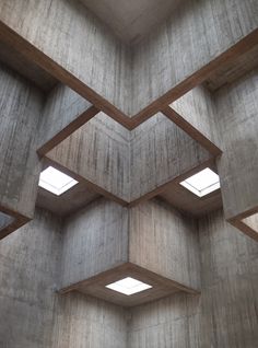 the interior of a building with multiple windows and concrete blocks on each side, all lined up in rows