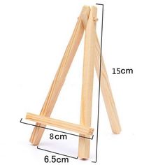 a wooden easel is shown with measurements