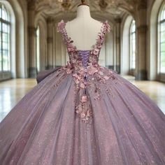 a dress on display in a room with large windows