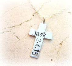 a cross necklace with the word jack on it