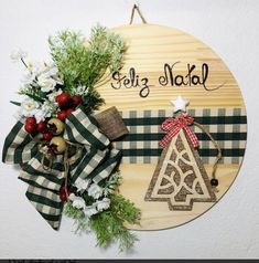 a wooden sign that says golf n'naal on it next to wreaths and decorations