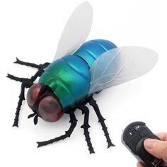 PRICES MAY VARY. 【Simulation Fly】The RC fly is high simulation with real-like shape, vivid color, 2 transparent wings, glowing eyes and 6 movable legs, just like a real fly crawling on the ground. 【Kids Toys & Gifts】The fly is so realistic, which is a great Toys & Gifts for kids' birthday, Halloween, Christmas or other. Your Kids will love it definitely. 【Remote Control Functions】Crawl Forward, Back Rotation. There is a flash red light on the head of fly. 【Specifications】Remote Control Distance: Transparent Wings, Halloween Pranks, Spider Toy, Bug Car, Best Christmas Toys, Prank Toys, Glowing Eyes, Bee Birthday, Practical Jokes