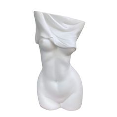 a white ceramic sculpture of a woman's torso with a sheet draped over her head