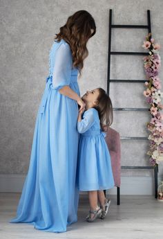 "Magnificent Dresses for Mother and Daughter ● A set of gorgeous dresses for mom and daughter! ● A perfect sample of a gentle and cute look ● A one-color model with a discreet, elegant cut ● Complemented by a row of pearl buttons on the back ● Sleeves slightly cover the elbow, elasticated cuff ● Dresses are not overloaded with unnecessary decor and look very adult ● Different colors are available, if there is no color you need, then contact the manager ● Dresses are closed on the side with a hid Modest Blue Wedding Dress, Magnificent Dresses, Dresses For Mom And Daughter, Burgundy Maternity Dress, Mommy Daughter Dresses, Blush Maternity Dress, Boho Bridal Dress, Mother Daughter Dresses Matching, Maternity Long Dress