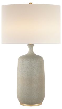 a table lamp with a white shade on it