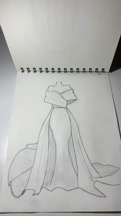 a pencil drawing of a dress on paper