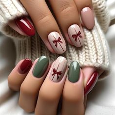 Embrace the holiday spirit with these elegantly simple Christmas nails, adorned with charming painted-on bows. Each hand displays five fingers, showcasing nails painted in soft, festive shades of red and green, complete with a glossy finish that enhances their sophisticated appeal. The highlight of this design is the minimalist bows painted directly onto one or two nails per hand. These bows are not overly ornate but are rather subtle, adding a stylish and refined festive touch. Perfect for those who prefer a chic and understated holiday look, these nails blend traditional Christmas colors with a modern, artistic flair. Simple Xmas Nails Red And Green, Christmas Nails Gift Design, Christmas Themed Gel Nails, Nail Red Ideas, Nail Idea Christmas, Nails Idea For Christmas, Nail Art Ideas For Christmas, Cute Nails Christmas Simple, Christmas Ideas For Nails