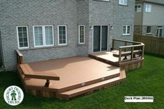 a wooden deck in front of a brick building