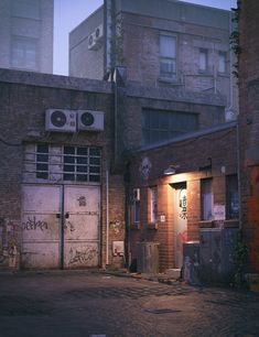 an alleyway with graffiti on the walls and two garage doors that are open at night