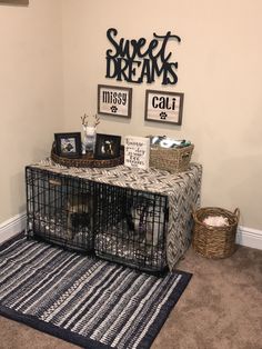 a dog cage sitting on top of a rug in front of a wall mounted sign