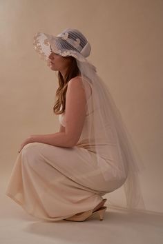 Absolutely iconic 1970s sunhat veil - we are obsessed. This gorgeous hat is trimmed in floral crochet and features a bow at the back. The veil is attached inside the hat and features two layers of tulle. We love this veil for a garden wedding or even for a bridal shower or bachelorette party. Listed size: N/A Modern size: OSFM Length of veil: 36" Crown: 19" Material: Tulle mix Origin unknown Condition: Excellent Los Angeles Showroom: This dress is available for try on at our Los Angeles showroom in Echo Park. To book an appointment, please click here: https://saturn.as.me/schedule.php Returns: We accept returns for store credit within 14 days of purchase. Your credit can be used on any item online and through our instagram. If you would like to make a return, please send Transplant Vintage Veil Fascinator, Crochet Appliqué, Hat Veil, Veil Hat, Veiled Hats, Wedding Veil Accessories, Floral Crochet, Echo Park, Headpiece Wedding