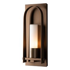 Triomphe 6 Inch Outdoor Wall Light by Hubbardton Forge Triomphe Outdoor Wall Light by Hubbardton Forge - 302030-1006 The Triomphe Small Outdoor Sconce is 16  in height and features this collections trademark handcrafted classical arch with craftsman tenon details on an aluminum backplate, as designed by David Martin. Available with clear seeded or opal glass cylindrical shade and a selection of robust AAMA-rated Coastal Outdoor Finishes. - Triomphe 6 Inch Outdoor Wall Light by Hubbardton Forge Hubbardton Forge, Iron Lighting, Outdoor Sconces, Barn Lighting, Outdoor Post Lights, Outdoor Hanging Lights, Candelabra Bulbs, Outdoor Wall Lights, Aluminum Wall