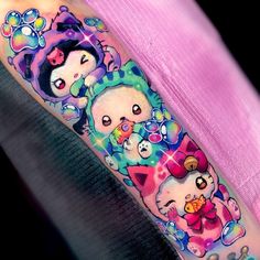 a woman with a colorful tattoo on her arm that has three bears in the background