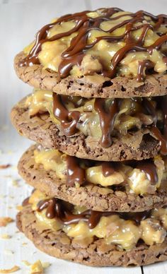 a stack of cookies covered in chocolate and caramel