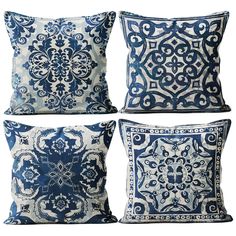 four blue and white pillows with decorative designs on the front, back and side sides