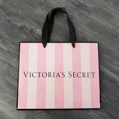 a victoria's secret shopping bag sitting on the floor