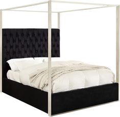 a bed with a black headboard and white sheets on it's sides, in front of a white background