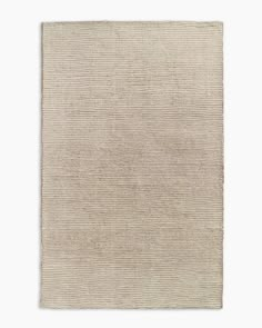 a beige rug on a white background with no one in it or someone out there