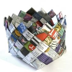 a paper cup that is made out of newspapers