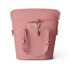 a pink bucket with a tag attached to the handle and two handles on each side