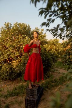 Red Colour Midi skirt- Gathered high-rise waist- Concealed zipper at the side- Straps with adjusters at the backCOMPOSITION: 100% polyesterMade in EnglandDry cleanModel is 5ft 9in and wears a size UK8Size Guide (in cm):UK4: Bust 76, Waist 58, Hip 83UK6: Bust 80, Waist 62, Hip 87UK8: Bust 84, Waist 66, Hip 92UK10: Bust 88, Waist 70, Hip 95UK12: Bust 92, Waist 74, Hip 99About Szabo SihagDesigner ready-to-wear label Szabo Sihag was established by Meghna Sihag and Krisztian Szabo in 2019. It is a Lo Apple Photoshoot, Red Maxi Skirt Outfit, Photoshoot Red Dress, Skirt Photoshoot, 2020s Fashion, Red Maxi Skirt, Luxury Clothing Brands, Mother Wedding, Maxi Skirt Outfits