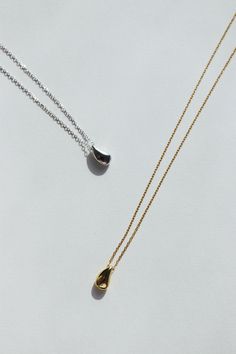 A simple sculptural teardrop strung on sterling silver or 14K gold plated necklace. Designed to suit any occasion, it's dainty, timeless and elegant. ◊ Sterling Silver or 18k Gold Vermeil ◊ Necklace measures 46cm long ( 41cm + 5cm extension) ◊ Teardrop pendant Measures Width 0.6 cm x Height 1.1 cm ◊ Easy round lobster claw closure ◊ Delivered in our beautiful Pina Blue box, perfect for gifting! SAY HI TO US Instagram: @thepinablue Pinterest: https://www.pinterest.com/thepinablue Facebook: https: Formal Teardrop Drop Necklace With Delicate Chain, Modern Drop Necklace As A Gift, Modern Drop Necklace As Gift, Modern Drop Necklace For Gift, Formal Drop Necklace With Delicate Chain, Minimalist Teardrop Pendant Drop Earrings For Everyday, Minimalist Teardrop Pendant Drop Necklace For Formal Occasions, Sterling Silver Teardrop Drop Necklace With Adjustable Chain, Minimalist Teardrop Pendant Necklace With Polished Finish