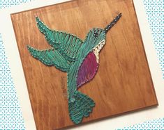 a piece of art that looks like a hummingbird