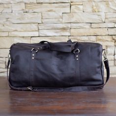 This duffel bag is crafted from luxurious Italian full-grain, vegetable-tanned cow leather, and it's perfect for a weekend getaway or a longer trip.  The bag has a timeless, practical design that is appropriate for either gender. The exceptionally supple leather makes it a joy to hold. A bag of that kind, at once fashionable and functional, would be an eternal favorite of anyone who enjoys "escaping."  Feel free to get in touch with us for any information that you may need. Features: ⦁Full-grain Leather Duffle Bag With Smooth Grain For Weekend Trips, Leather Duffle Bag For Weekend Trips, Leather Duffle Bag With Smooth Grain For Overnight Trips, Smooth Grain Leather Duffle Bag For Overnight Trips, Leather Duffle Bag With Luggage Sleeve For Overnight Trips, Leather Gym Bag With Luggage Sleeve For Overnight Trips, Brown Smooth Grain Duffle Bag For Overnight Trips, Brown Smooth Grain Duffle Bag For Weekend Trips, Luxury Soft Leather Weekender Bag For Trip