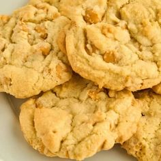 a white plate topped with cookies on top of a table