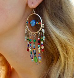 "🌈Funky Beaded Dangly Hoop Earrings🌈 Crazy mix-match beads, meet hoops, meet dreamcatchers? Whatever they are, they're my personal favorite! The way the sunshine hits the different colored translucent beads is magical! We call these the \"big mamas\" in our house because well.... they're not small. They have about a 2 inch dangle length and a 1 inch diameter.  Earring hook is nickel free! All earrings have the ability to be put on closing hook clasps for my peeps with gauges! Just message me:) Dreamcatcher Earrings, Dream Catcher Earrings, Earring Hook, Dreamcatchers, Hook Clasp, Our House, The Sunshine, Mix Match, Dream Catcher