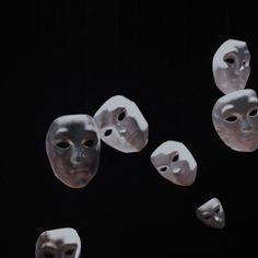 several masks are floating in the air