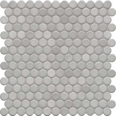 a white tile with circles on the bottom and one circle in the middle, as well as