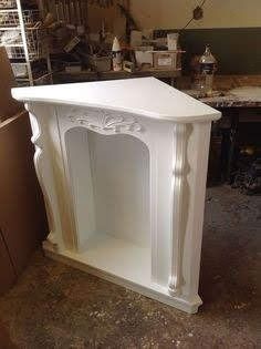 a white shelf sitting on top of a hard wood floor