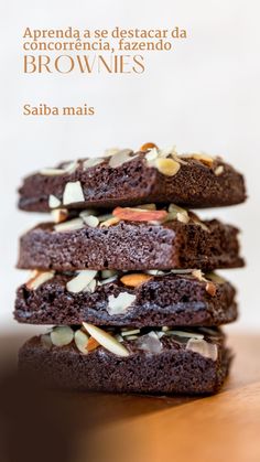 three brownies stacked on top of each other with almonds and chocolate chips in the middle