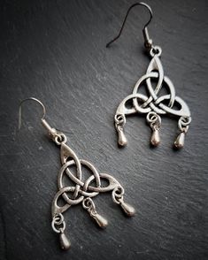 Celtic Triquetra Earrings Wiccan Jewelry  Celebrate the Maiden, Mother, and Crone with these gorgeous Handmade Earrings. The perfect gift for the witch in your life or really anyone with a dramatically dark fashion sense🖤 Handcrafted of Tibetian Silver and finished with ear wires for easy wear. Matching Bracelet available here👇 https://www.etsy.com/listing/811788451/silver-triquetra-bracelet-witch-wiccan Matching Necklace available here👇 https://www.etsy.com/listing/850545722/triquetra-neckla Wiccan Earrings, Triquetra Necklace, Wicca Jewelry, Celtic Knot Jewelry, Knot Jewelry, Wiccan Jewelry, Witch Fashion, Jewelry Knots, Witch Jewelry