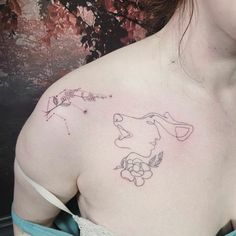 a woman with a tattoo on her chest