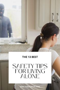 Young lady sitting at her countertop on her laptop. At the window beyond her left shoulder, we can see an intruder spying on her. He is wearing black and a black ski mask. Caption reads The 13 Best Safety Tips for Living Alone. House Safety Tips, Living Alone Safety Tips, Tips For Living Alone, Safety Moment Ideas, Single Woman Home, Single Woman Apartment